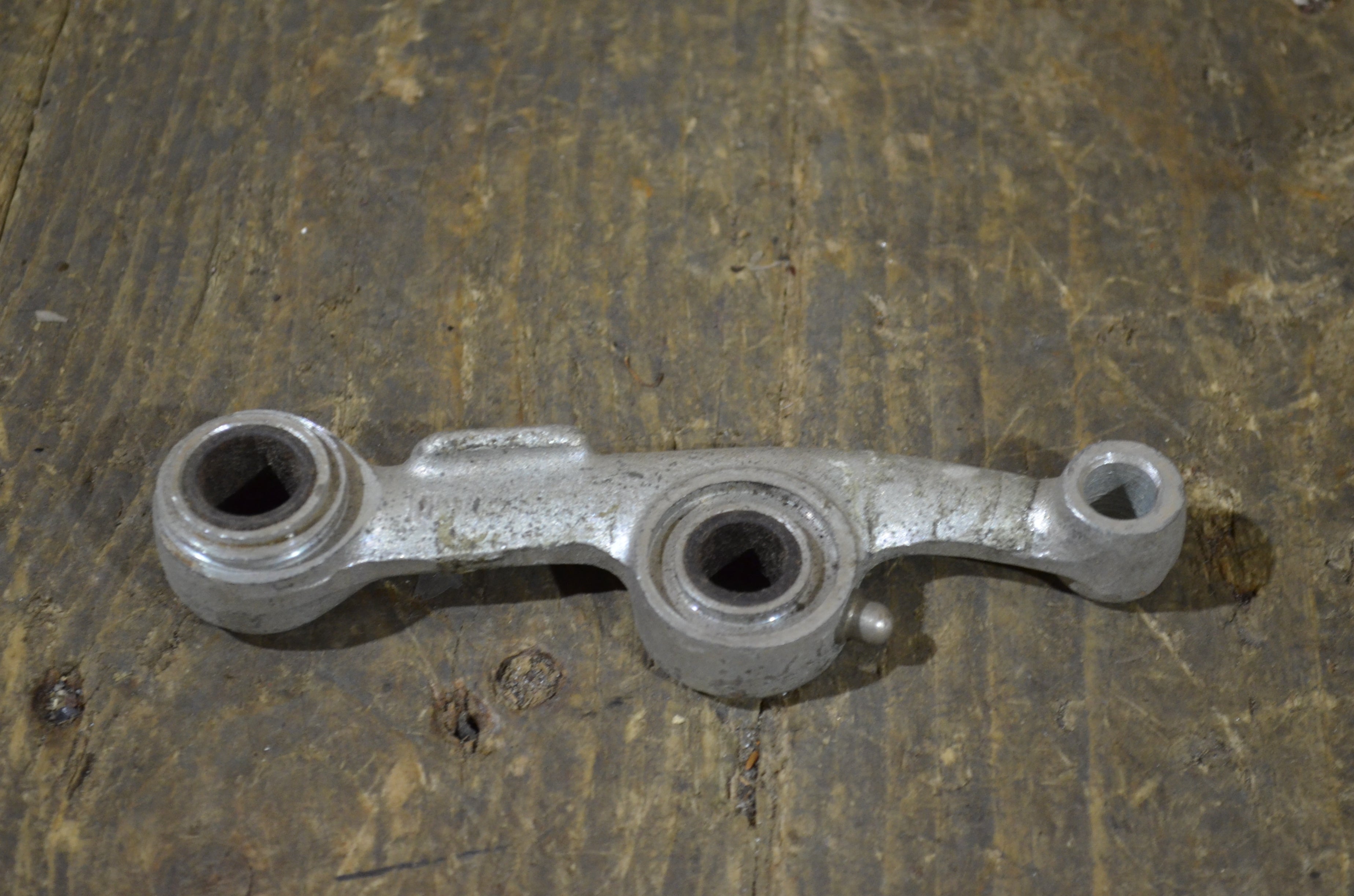 Honda C100 C102 C110 C65 ,Left Suspension Arm, NOS Honda Part Number 51220-001-000