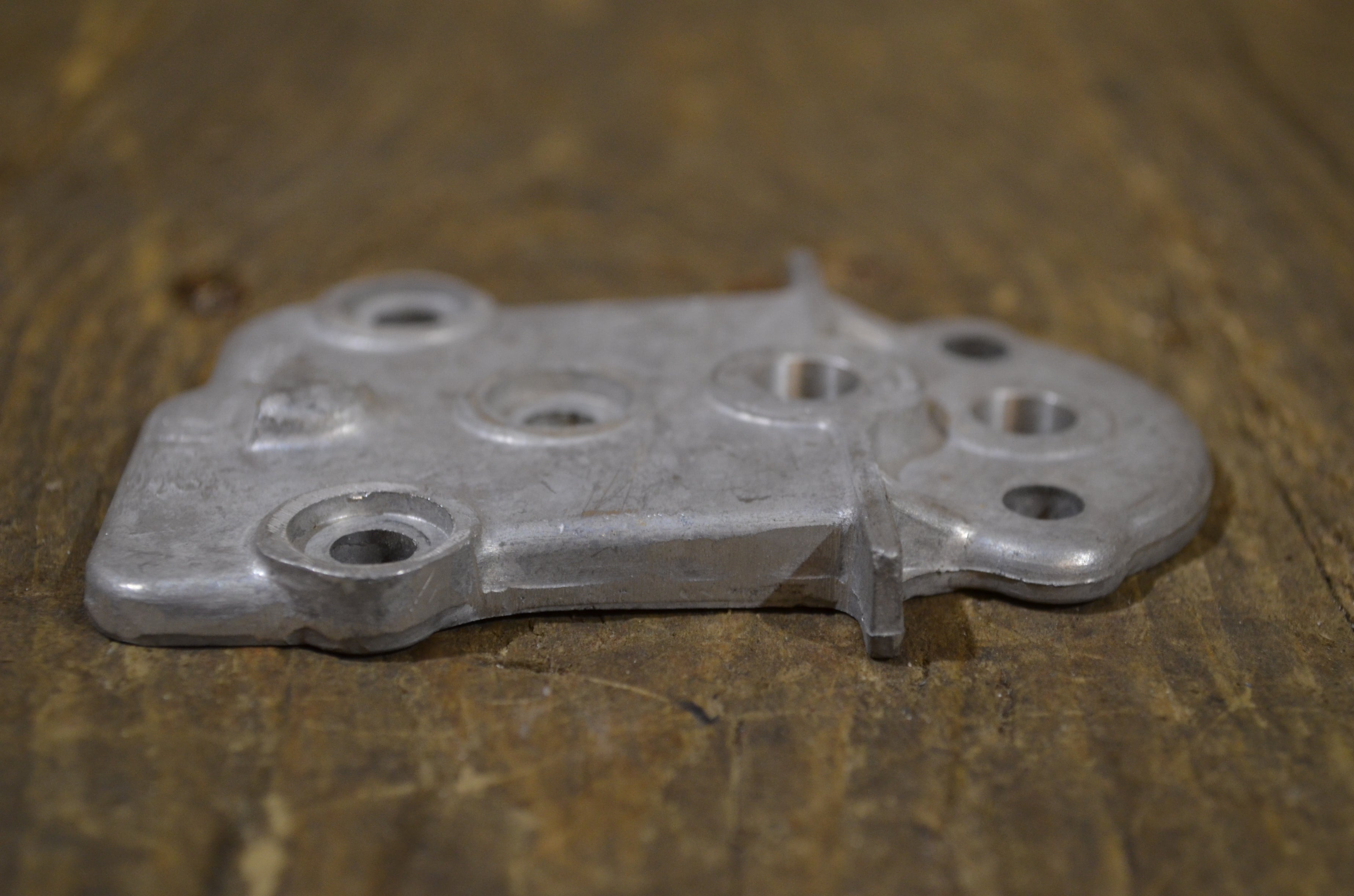 Honda C72 ,Oil Pump Cover, Genuine NOS Honda Part Number C7216012