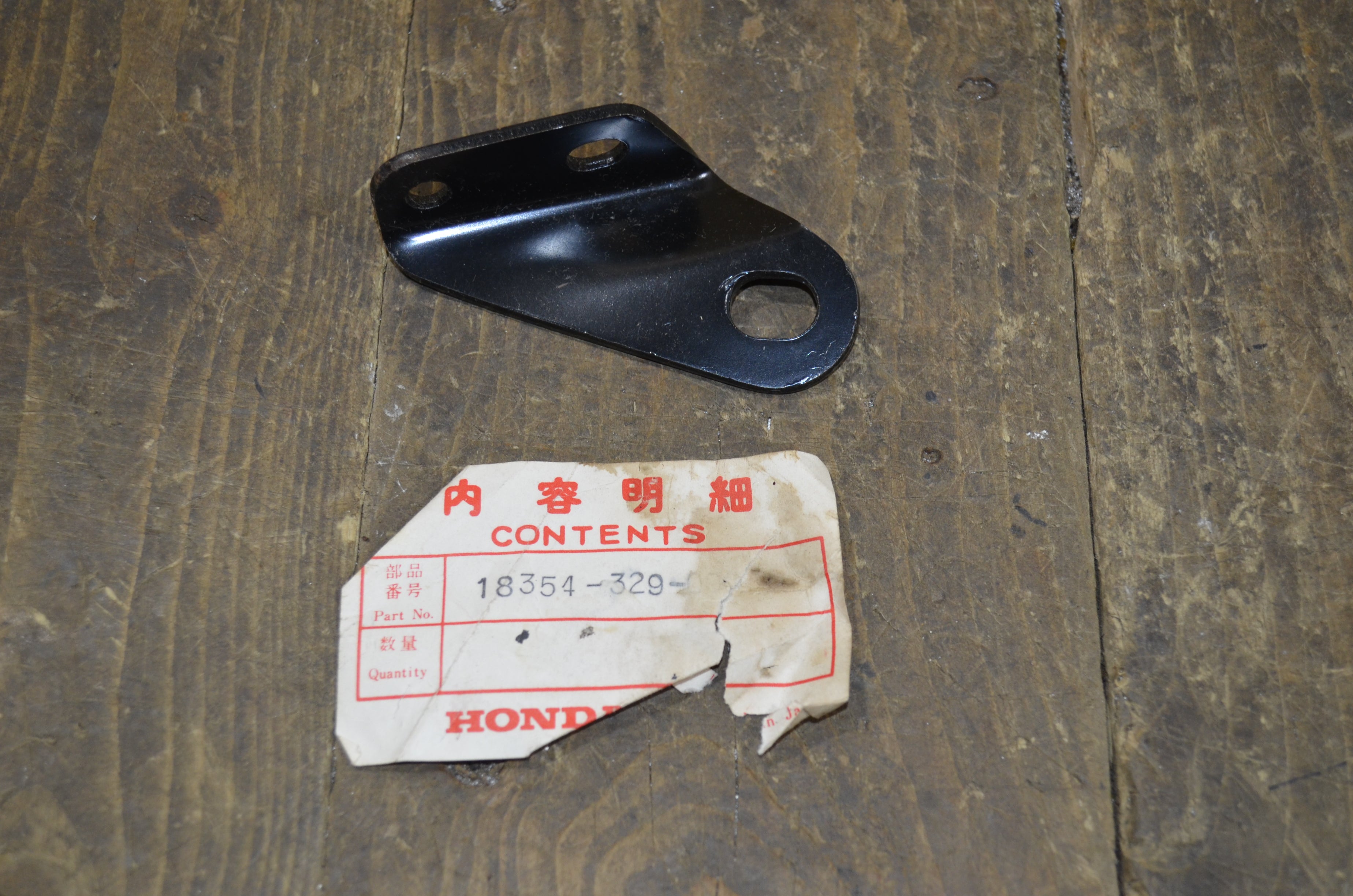 Honda SL250 XL250 ,Exhaust Bracket, Genuine NOS Honda Part Number 18354-329-000
