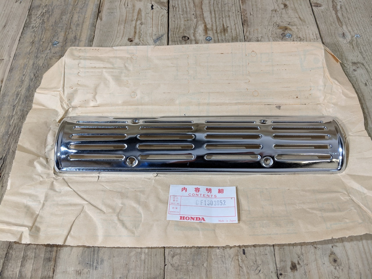 Honda S65 ,Exhaust Chrome Grill, Genuine NOS Honda Part Number CF1303952