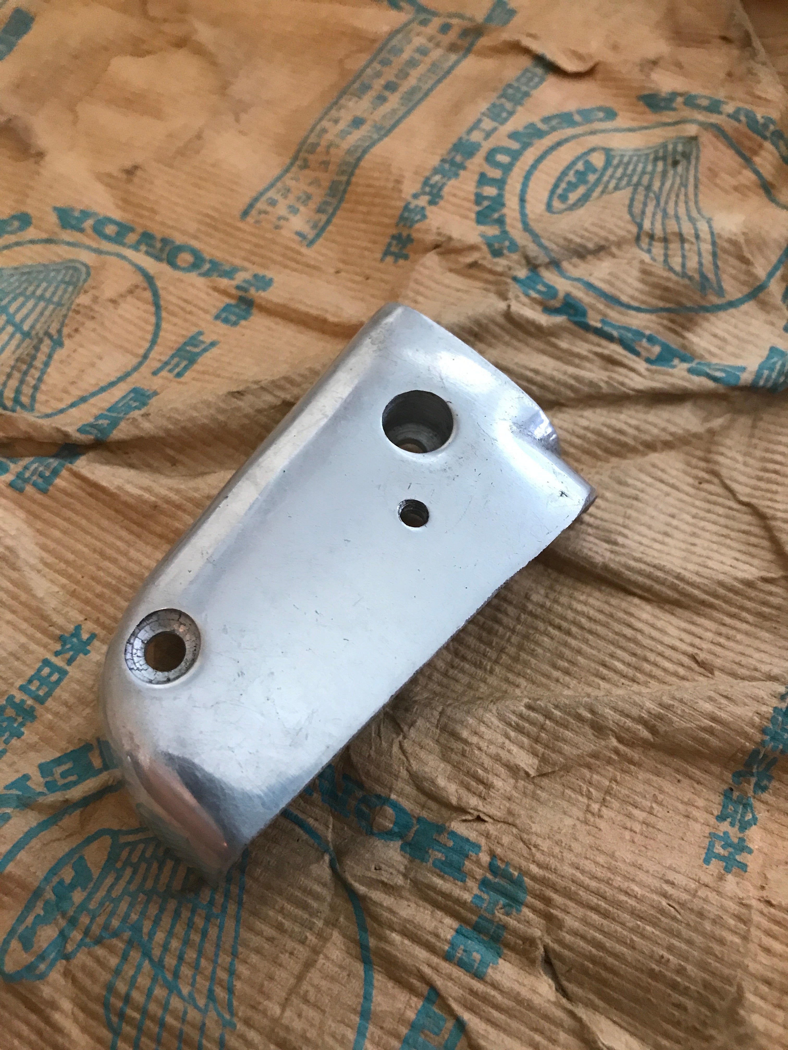 Honda C110 S50 ,Front Left Lower Indicator Case, NOS Honda Part Number 33471-011-010