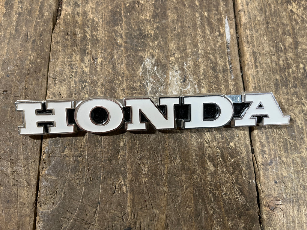 Honda CL450 ,Left Side Fuel tank Emblem, Genuine NOS Part Number 87122-294-670
