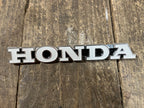 Honda CL450 ,Left Side Fuel tank Emblem, Genuine NOS Part Number 87122-294-670