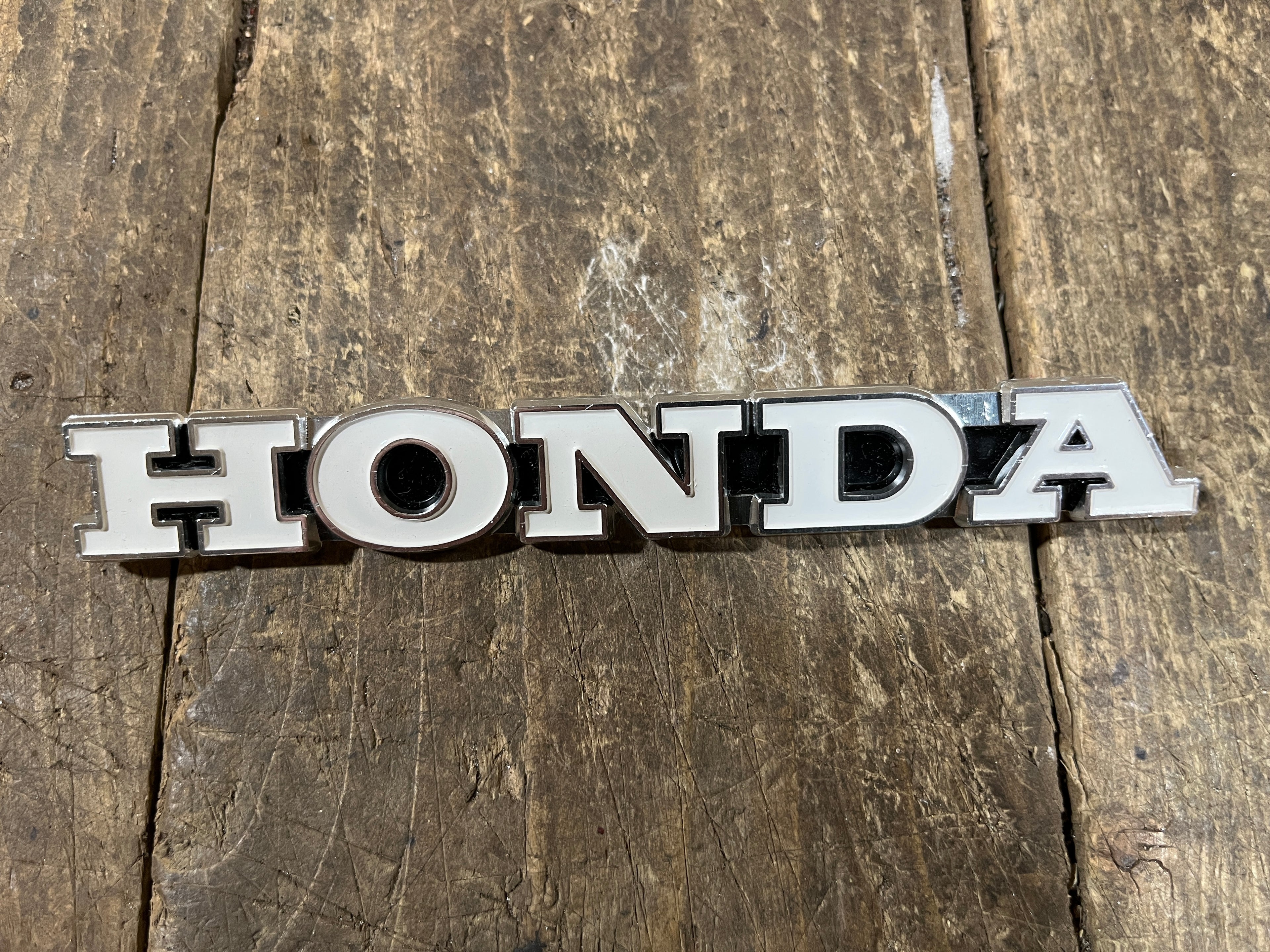 Honda CL450 ,Left Side Fuel tank Emblem, Genuine NOS Part Number 87122-294-670