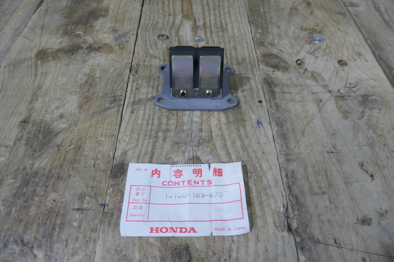 Honda CR80R 80-81 ,Reed Valve Block, NOS Genuine Honda Part Number 14100-169-670