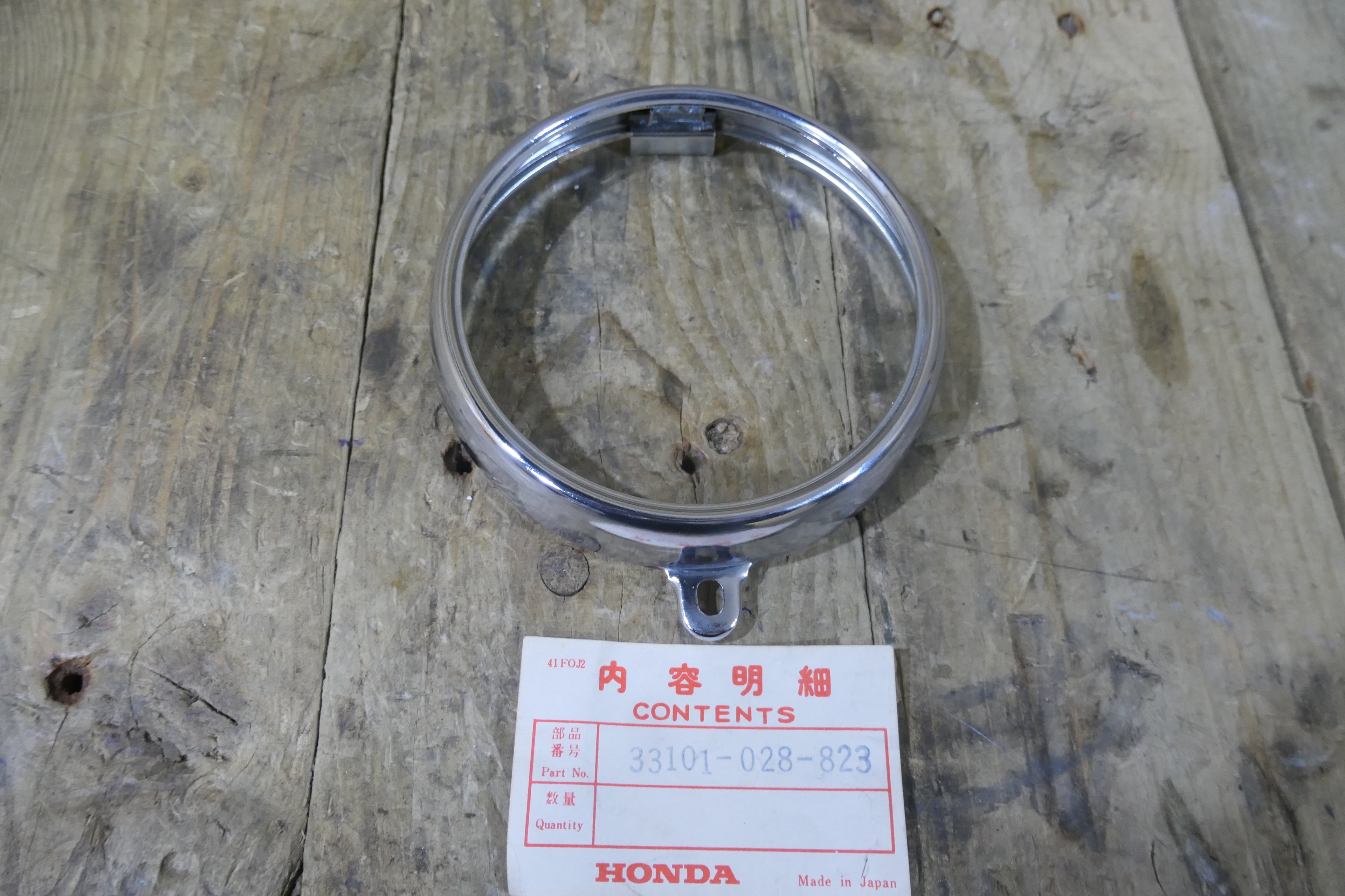 Honda SS50E ,Headlight Rim, Genuine NOS Honda Part Number 33101-028-823
