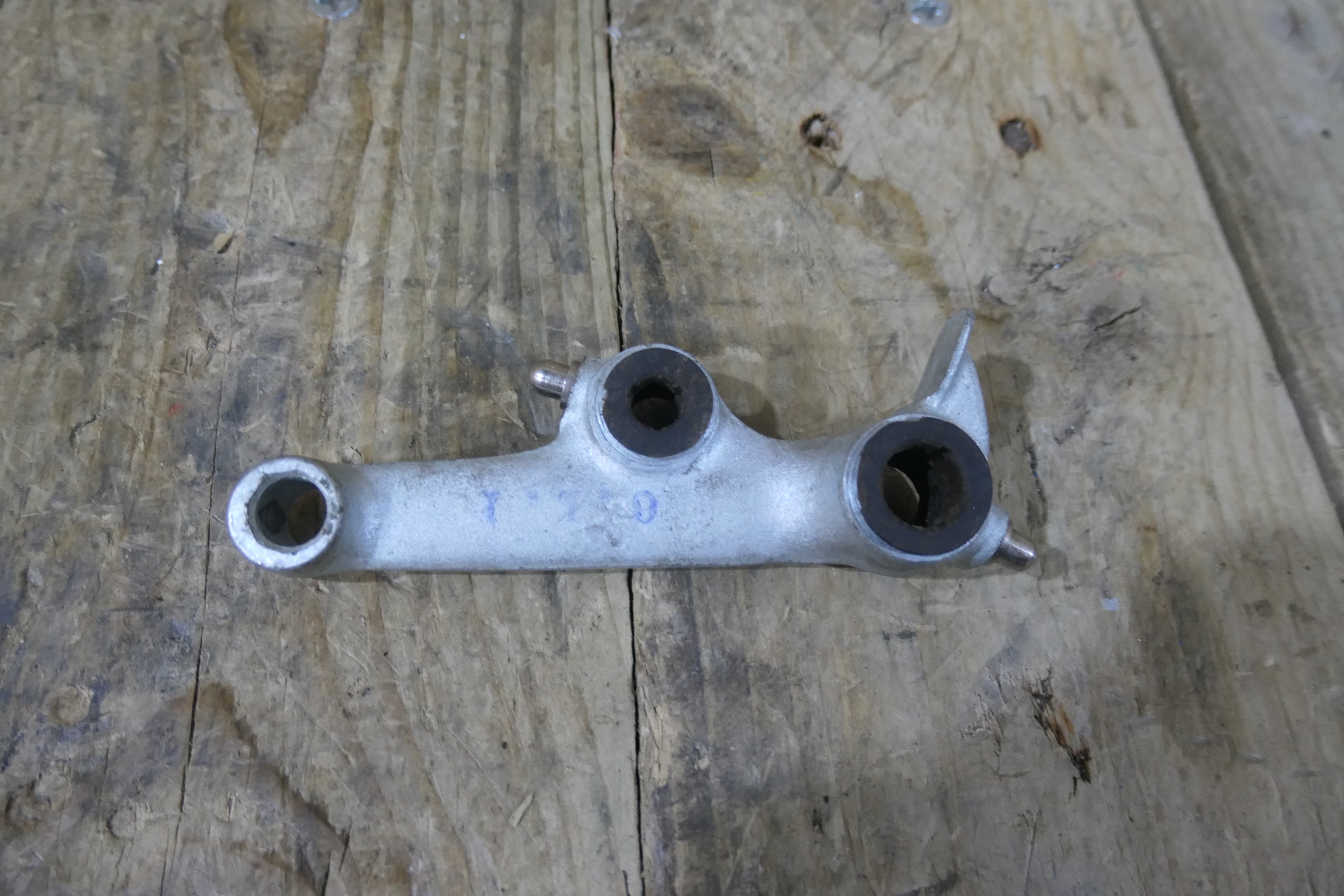 Honda P50 P25 ,Left Suspension Arm, Genuine NOS Honda Part Number 51220-044-040