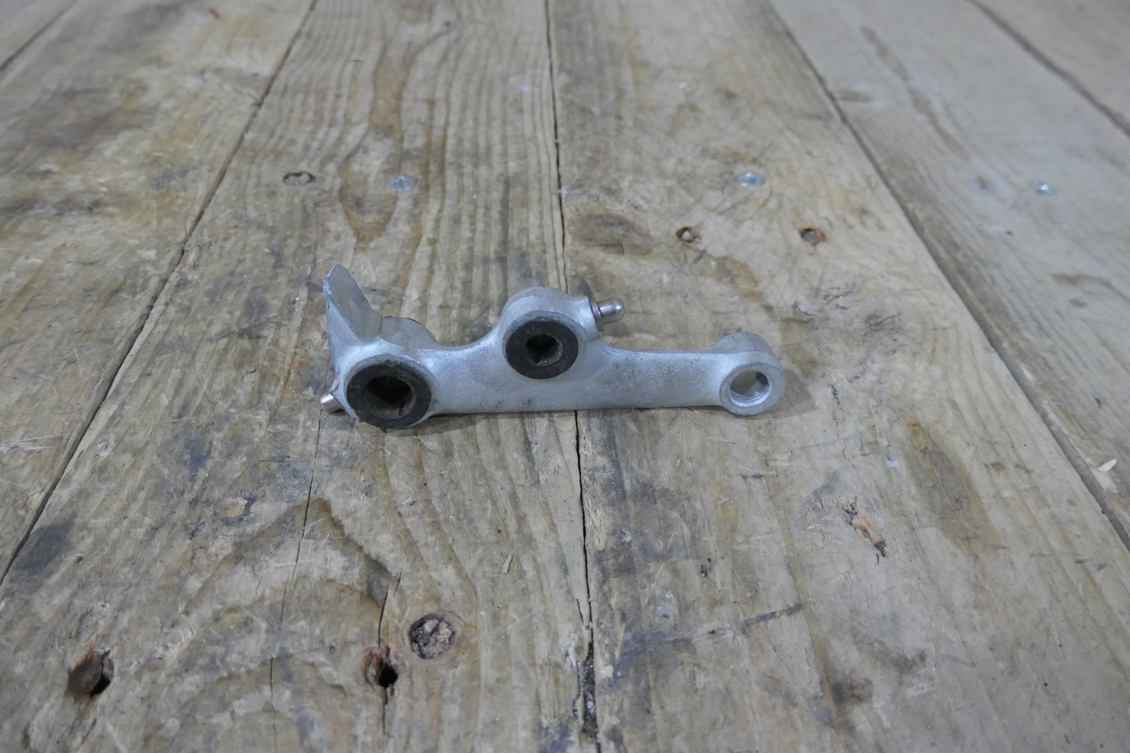 Honda P50 P25 ,Left Suspension Arm, Genuine NOS Honda Part Number 51220-044-040