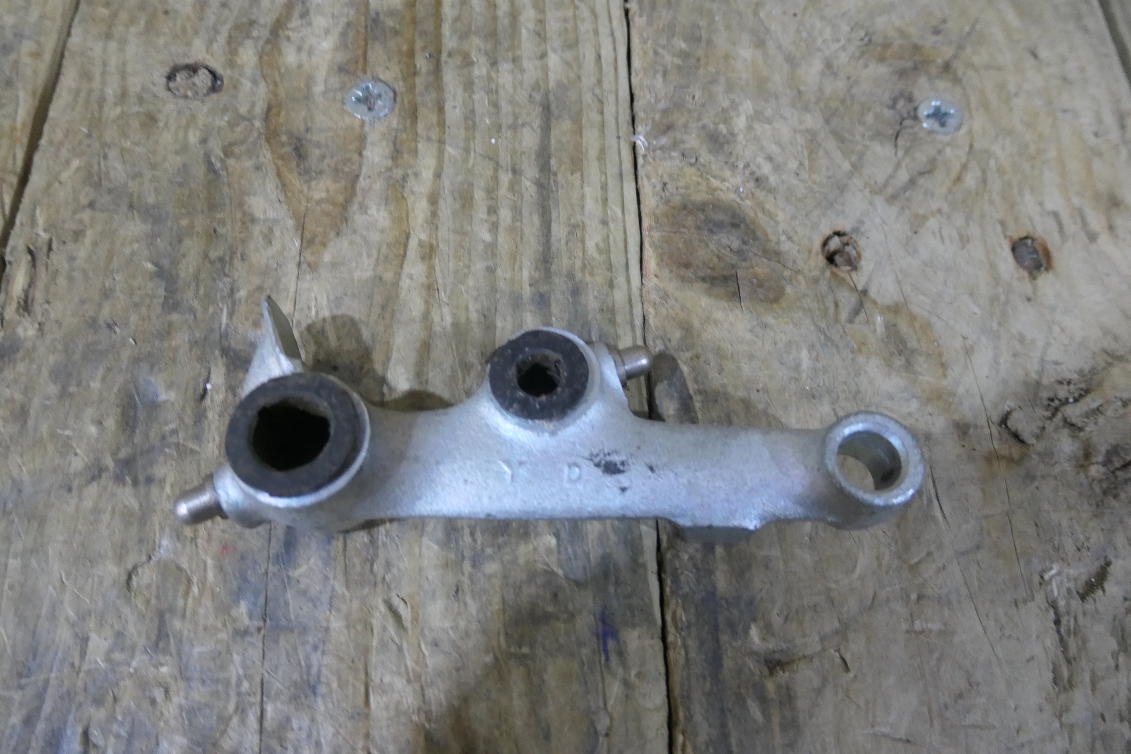 Honda P50 P25 ,Right Suspension Arm, Genuine NOS Honda Part Number 51210-044-040