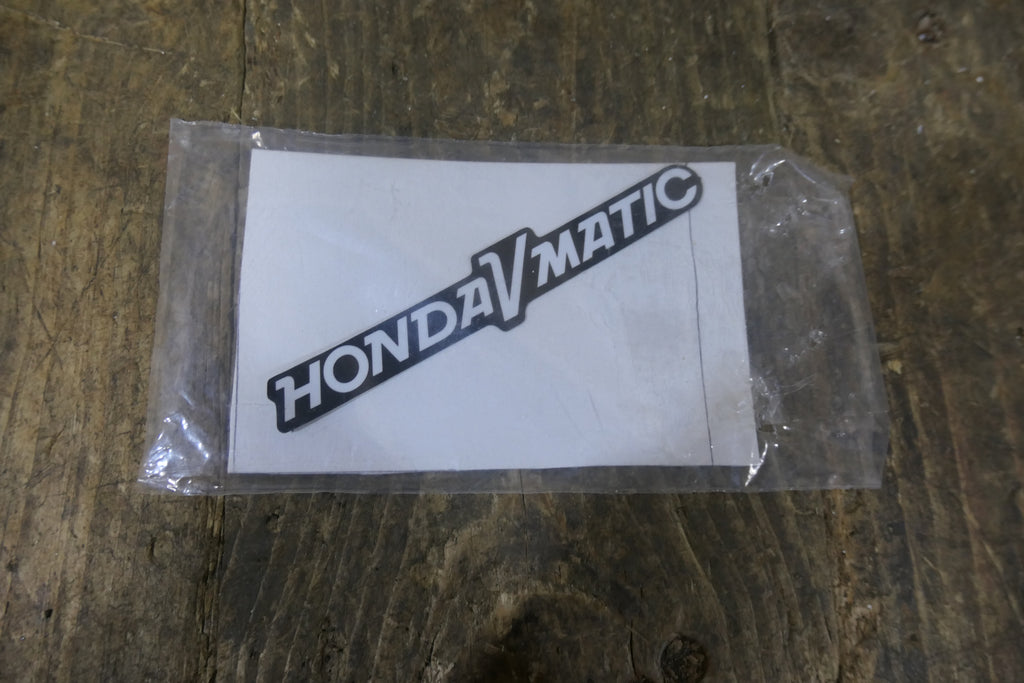 Honda NX50M Express ,Left Side Cover Emblem, Genuine NOS 11345-187-600
