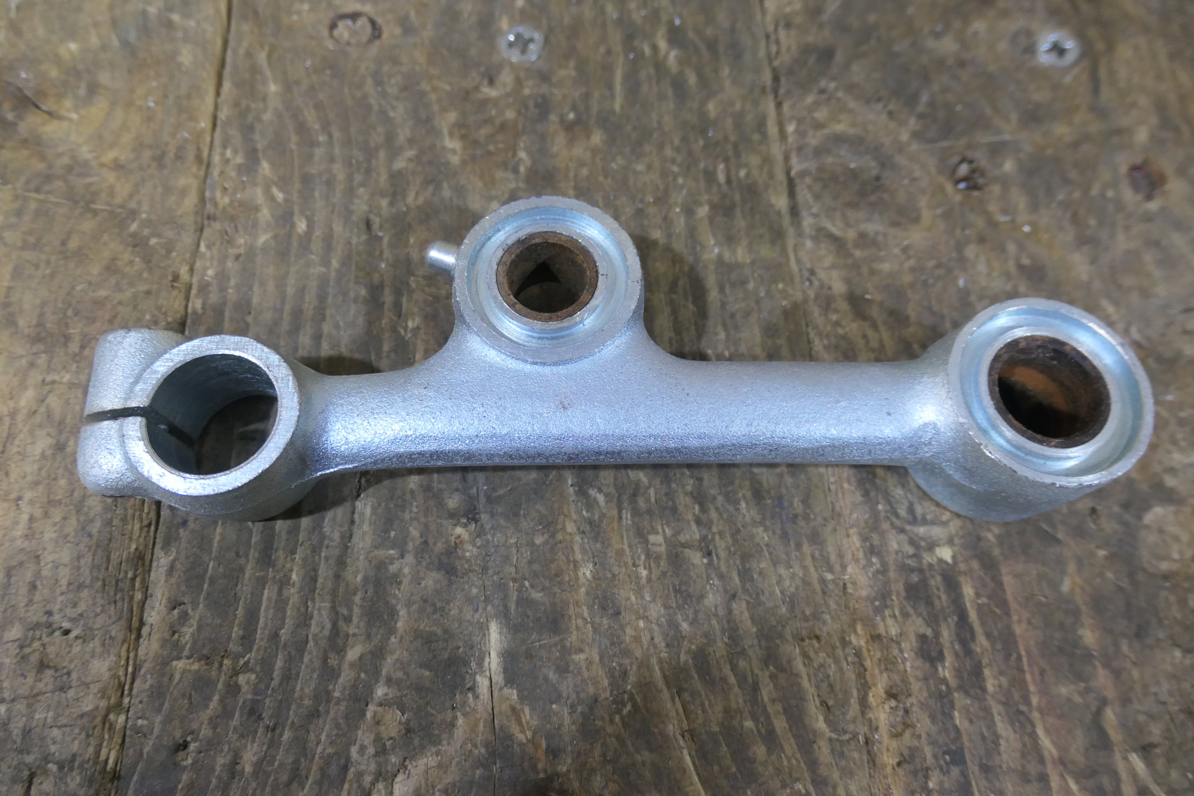 Honda C92 C95 ,Left Side Suspenion Arm, Genuine NOS Honda Part Number 51220-202-010