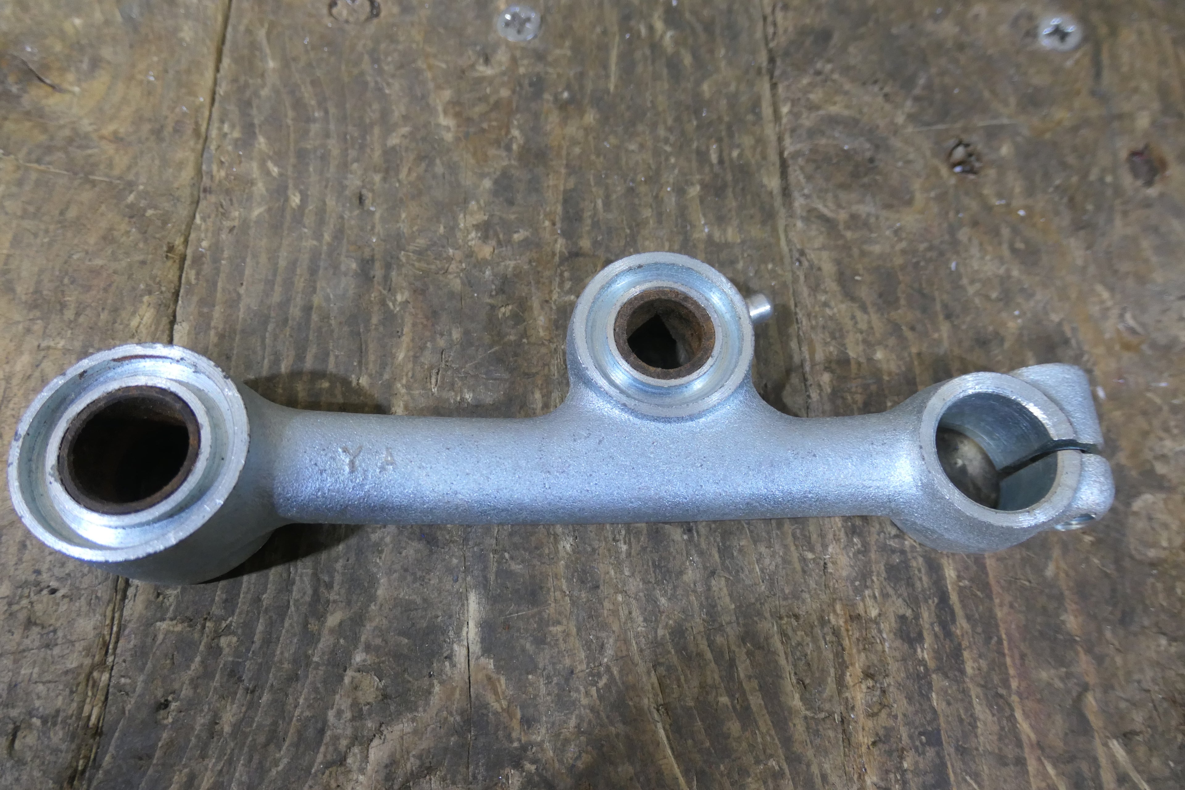 Honda C92 C95 ,Left Side Suspenion Arm, Genuine NOS Honda Part Number 51220-202-010