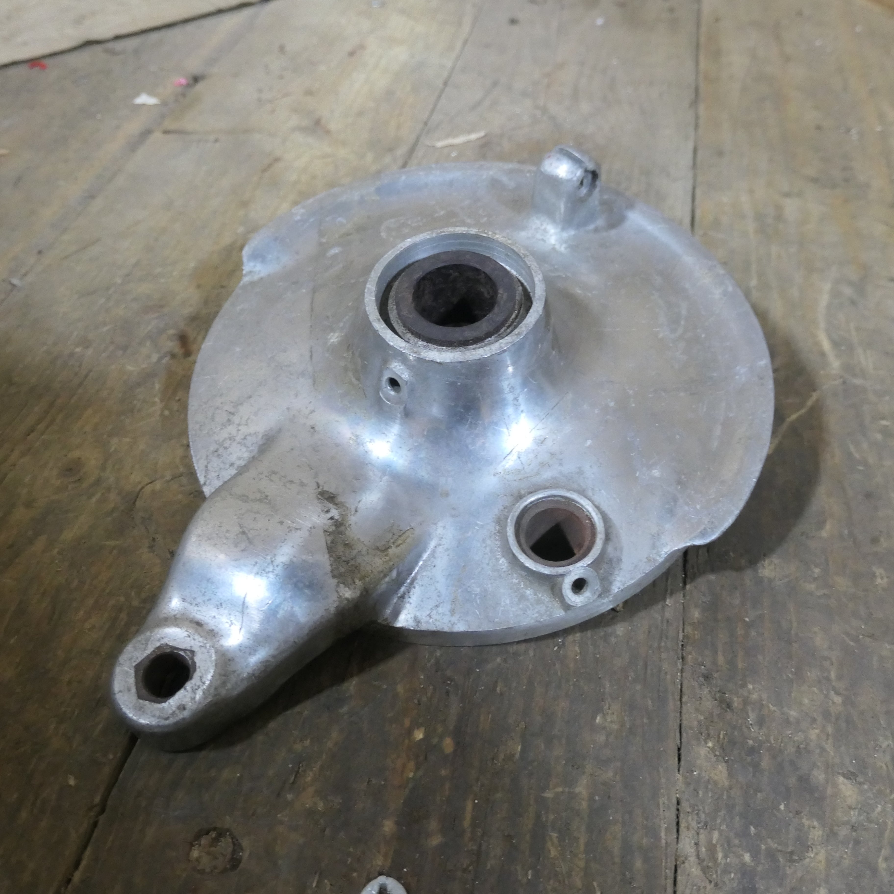 Honda C92 C95 ,Front Brake Plate, NOS Shop Soiled Honda Part Number 45100-202-020