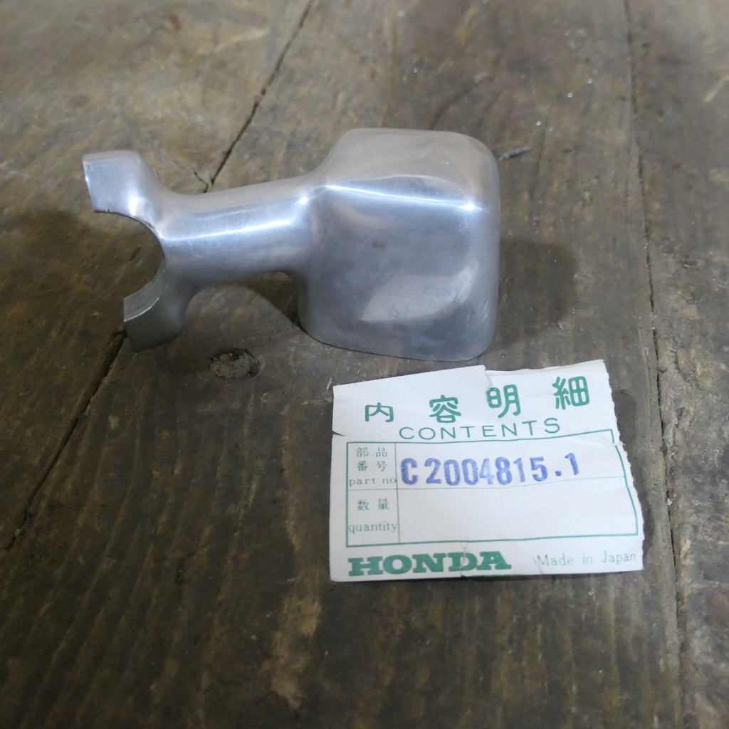 Honda C200 ,Left Indicator Base, Genuine NOS Honda Part Number C20048151