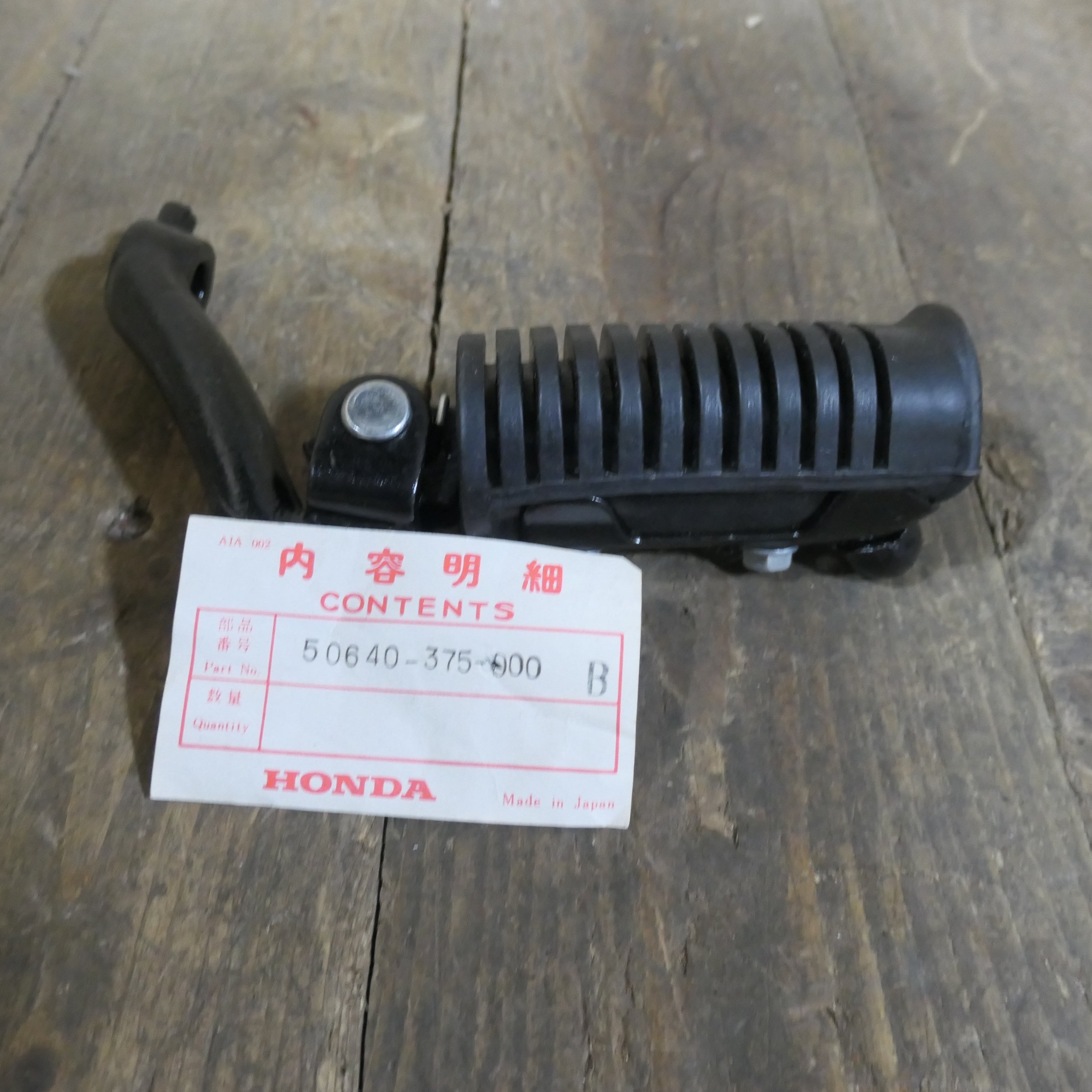 Honda CB500T ,Left Footrest Assembly, Genuine NOS Honda Part Number 50640-375-000B.