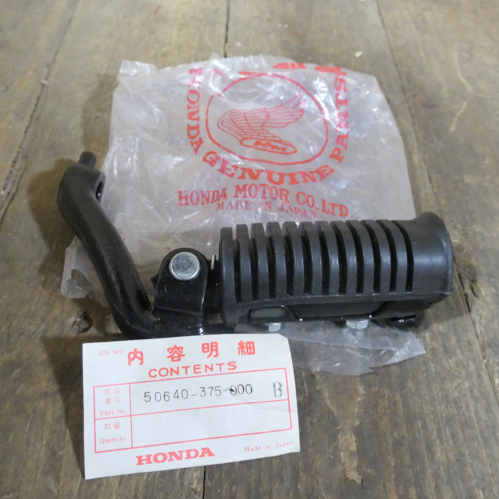 Honda CB500T ,Left Footrest Assembly, Genuine NOS Honda Part Number 50640-375-000B.
