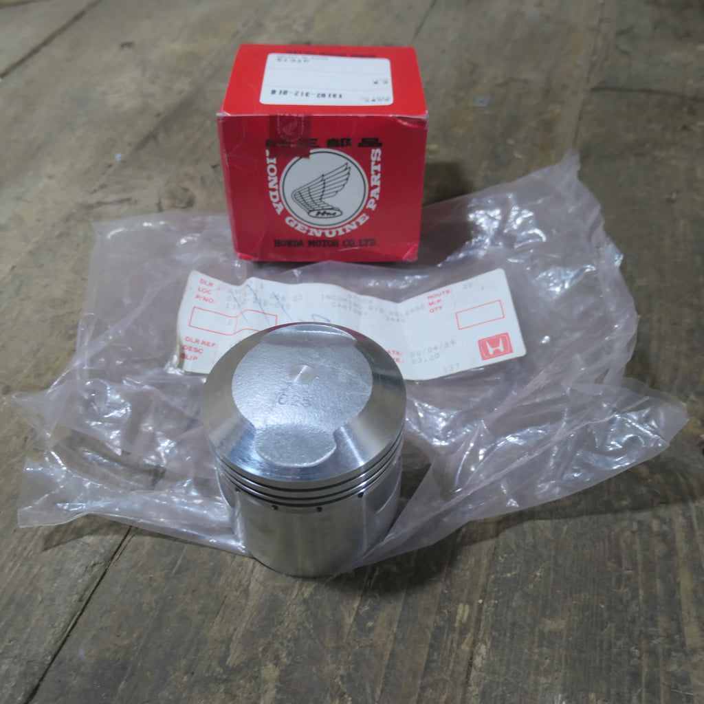 Honda CB350 ,Piston 0.25 Oversize, Genuine NOS Honda Part Number 13102-312-010.