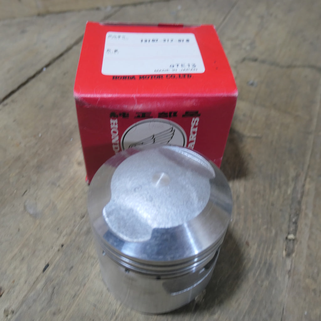 Honda CB350 ,Piston 0.25 Oversize, Genuine NOS Honda Part Number 13102-312-010.