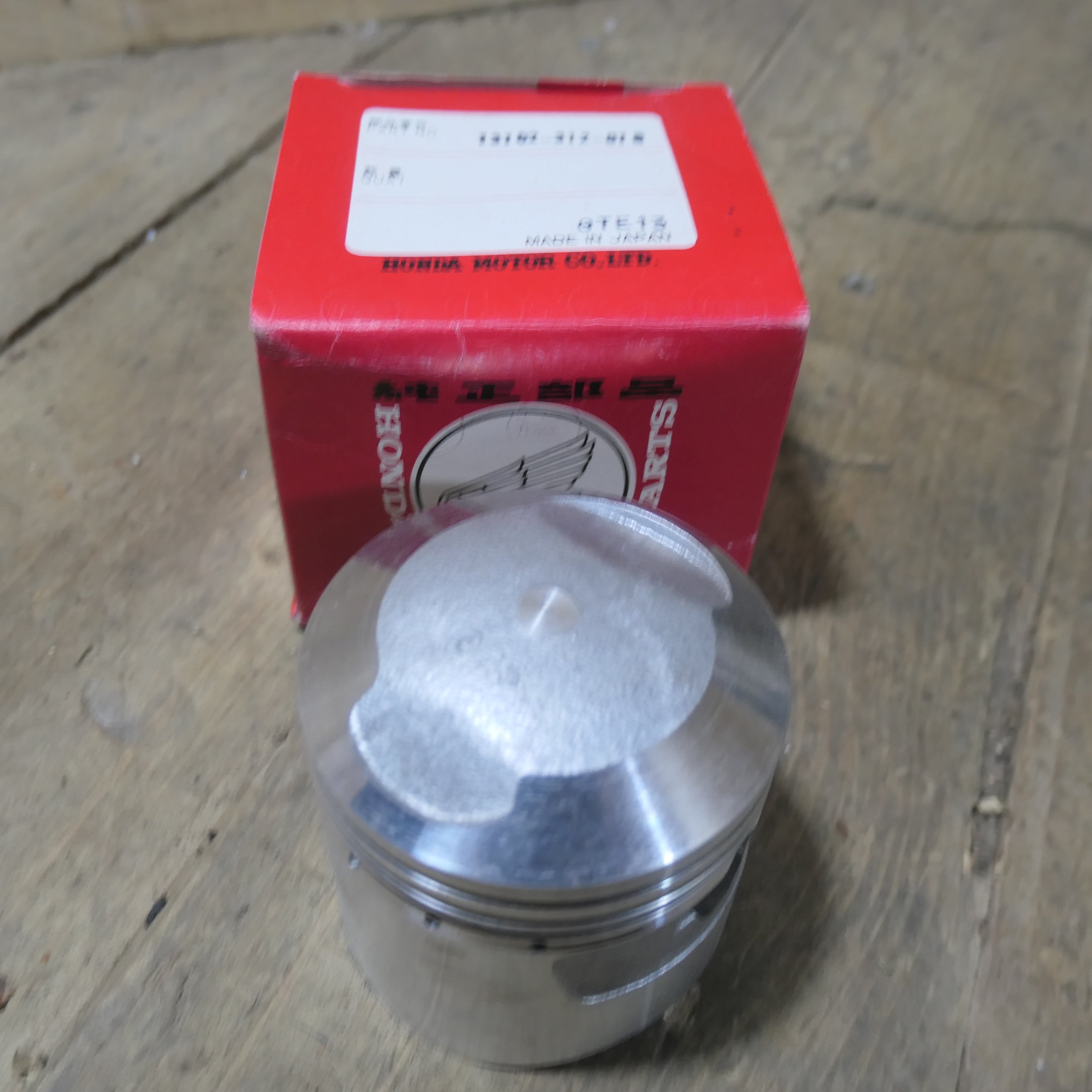 Honda CB350 ,Piston 0.25 Oversize, Genuine NOS Honda Part Number 13102-312-010.