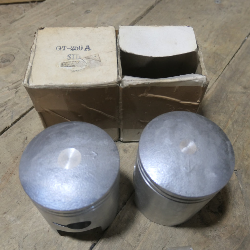 Suzuki ,GT250A Pistons, with Rings NOS In Original Boxes