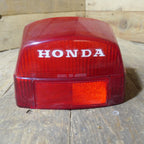 Honda CX500 CB650 CB750 ,Rear Tail Light Lens, NOS Honda Part Number 33702-415-601.