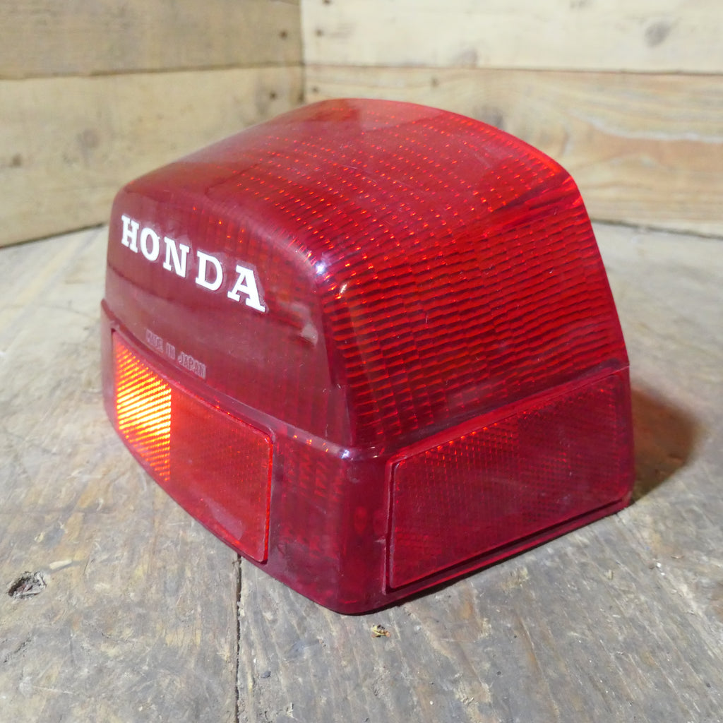 Honda CX500 CB650 CB750 ,Rear Tail Light Lens, NOS Honda Part Number 33702-415-601.