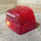 Honda CX500 CB650 CB750 ,Rear Tail Light Lens, NOS Honda Part Number 33702-415-601.