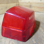 Honda CX500 CB650 CB750 ,Rear Tail Light Lens, NOS Honda Part Number 33702-415-601.