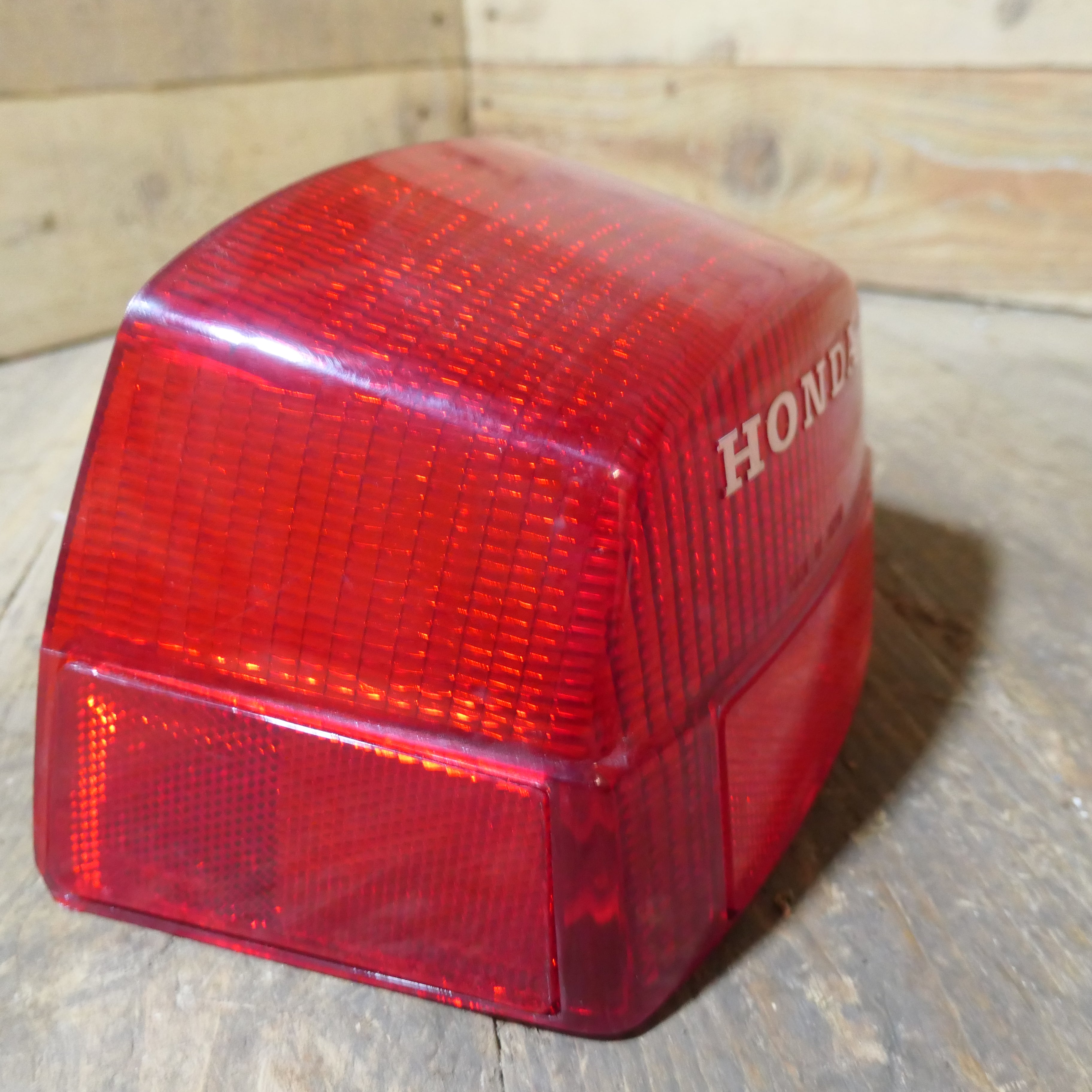 Honda CX500 CB650 CB750 ,Rear Tail Light Lens, NOS Honda Part Number 33702-415-601.