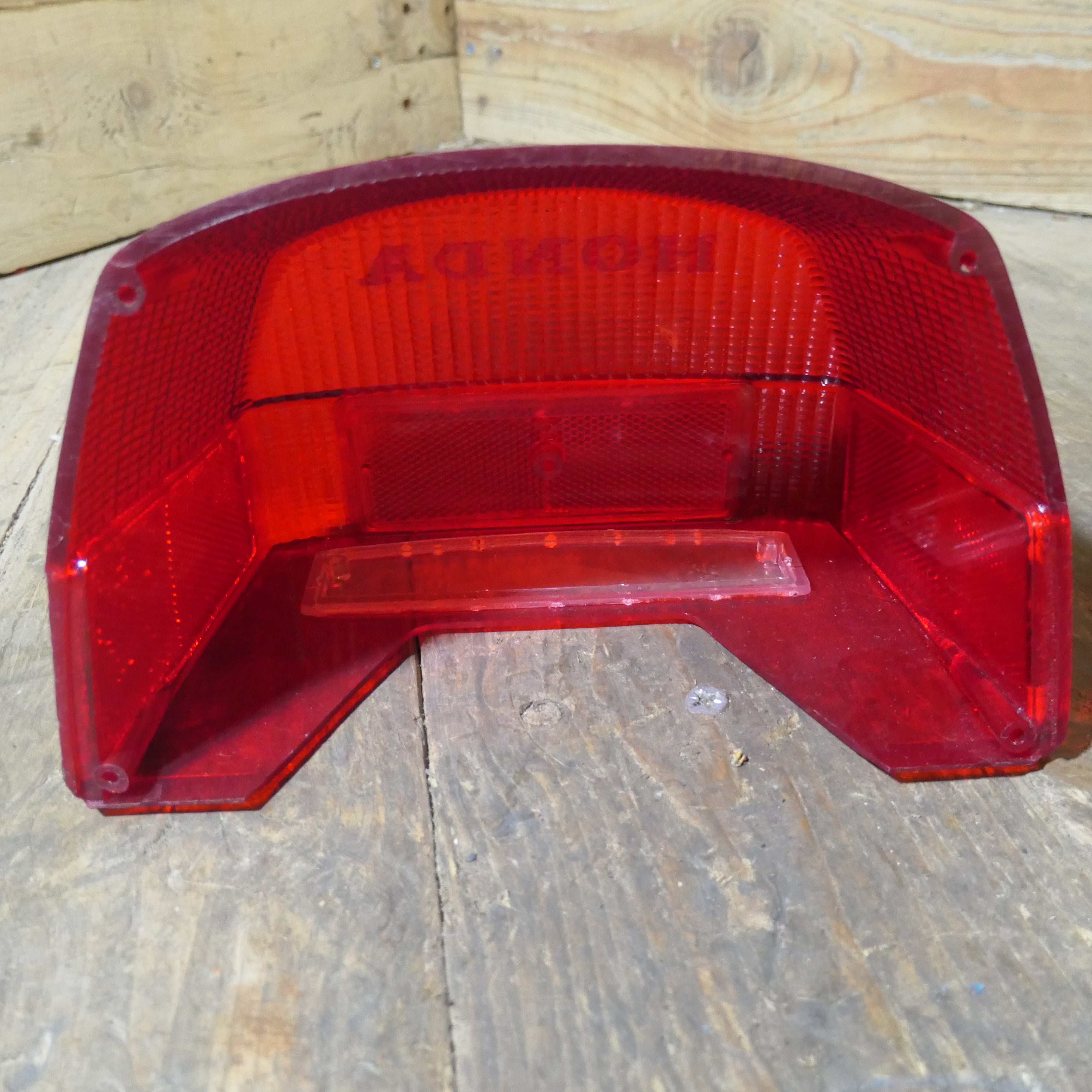 Honda CX500 CB650 CB750 ,Rear Tail Light Lens, NOS Honda Part Number 33702-415-601.